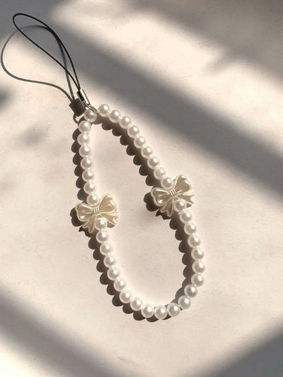 Elegance Pearl Bow Charm – Luxe Phone Strap Accessory